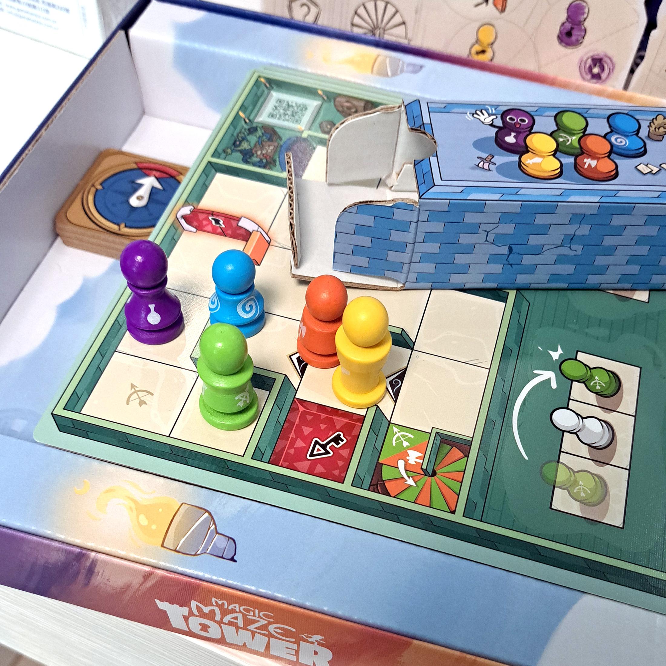 Close-up of pawns standing together on a maze board inside the game box.