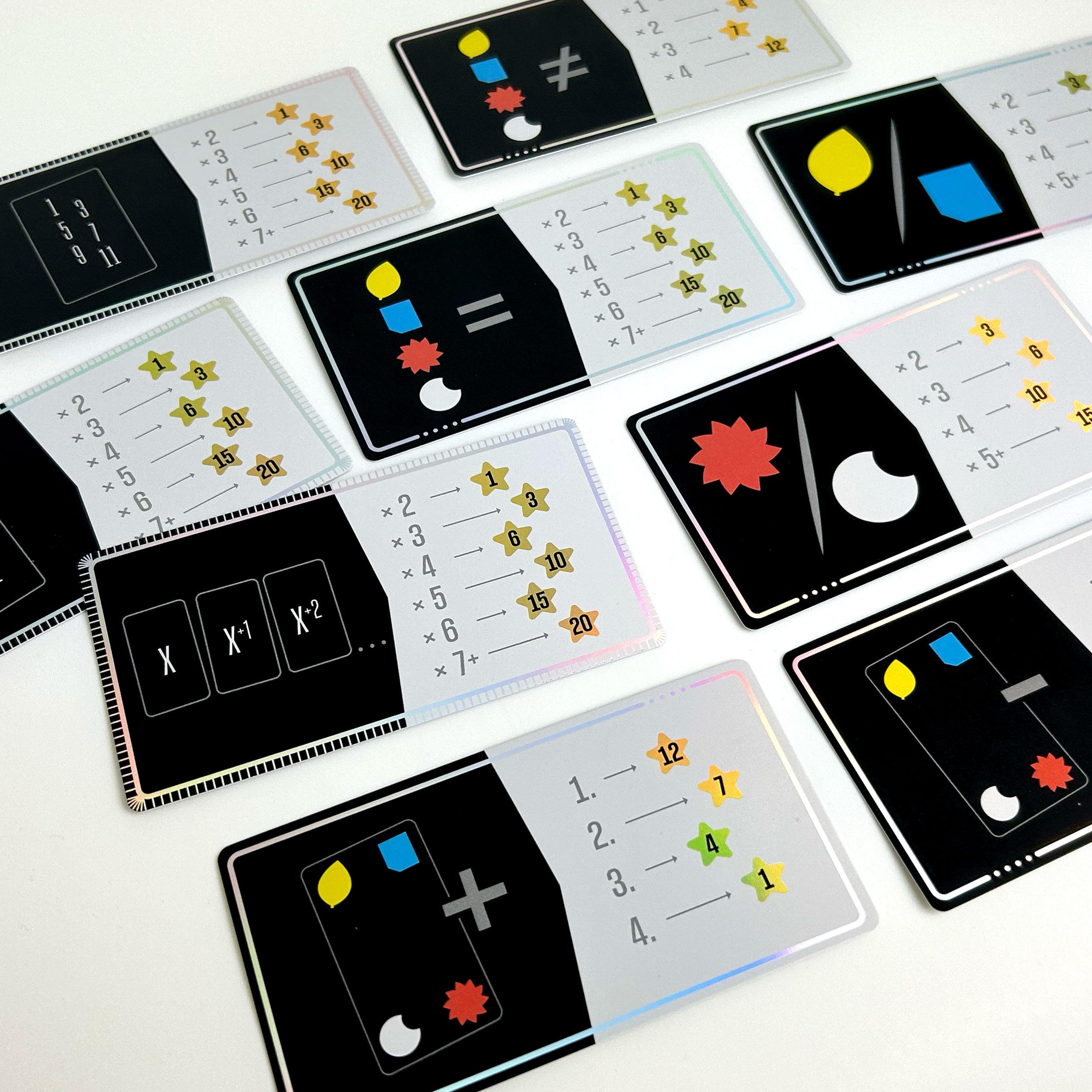 Scoring cards laid out, showing different scoring rules based on symbols, values, and combinations of false tricks.