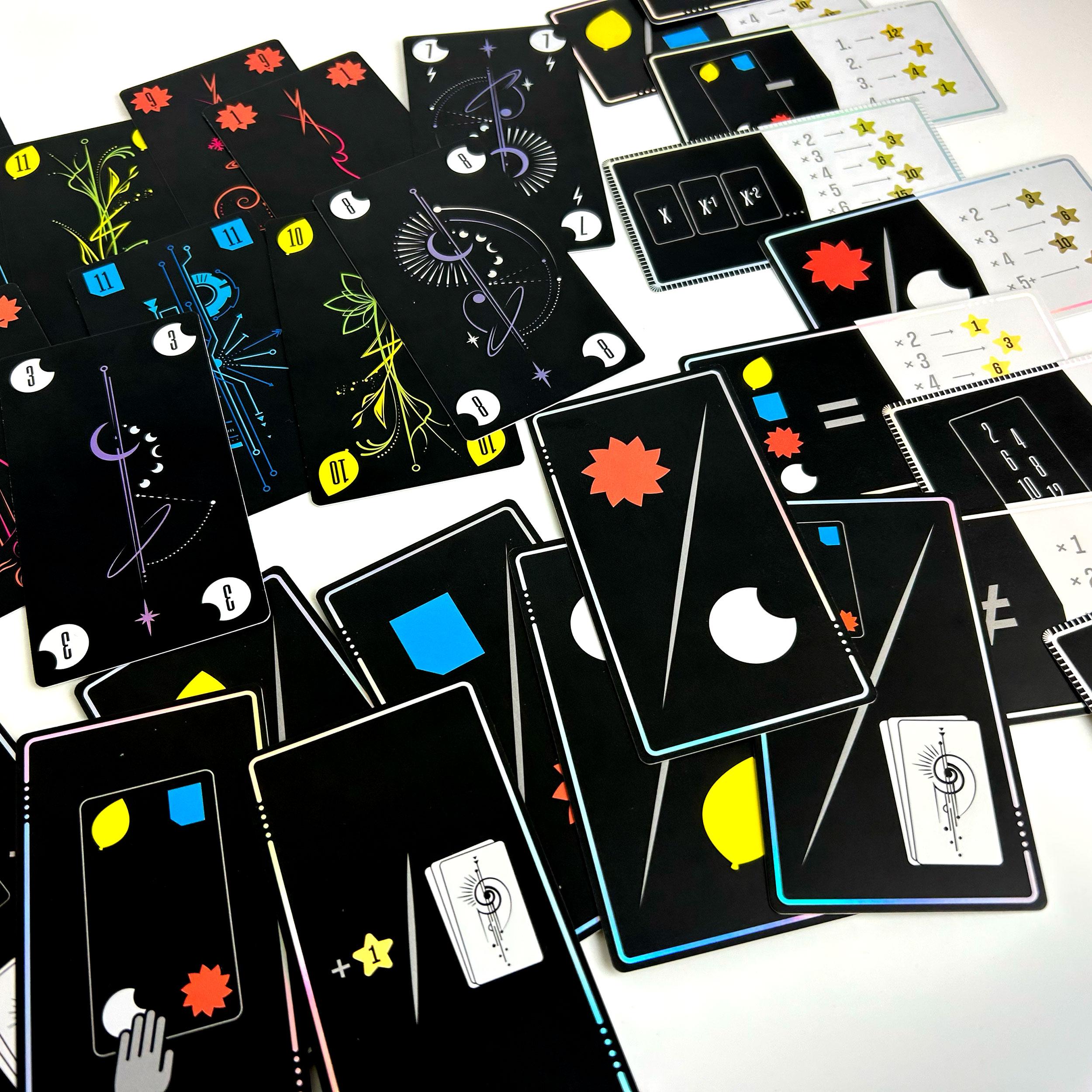 Full overview of all card types laid out together, including number cards, bonus cards, and scoring cards.